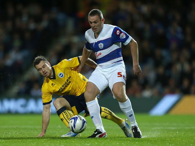 Ashley Barnes and Richard Dunne battle for the ball