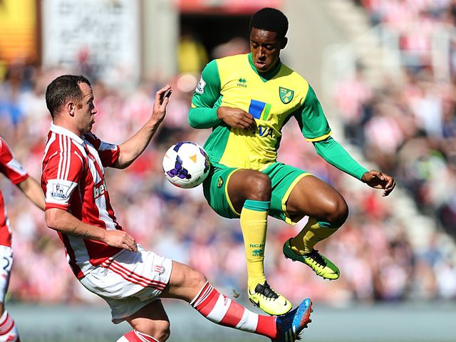 Charlie Adam and Leroy Fer compete for the ball