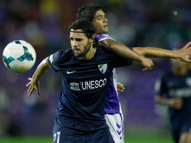 Sergio Sanchez competes for the ball with Humberto Osorio