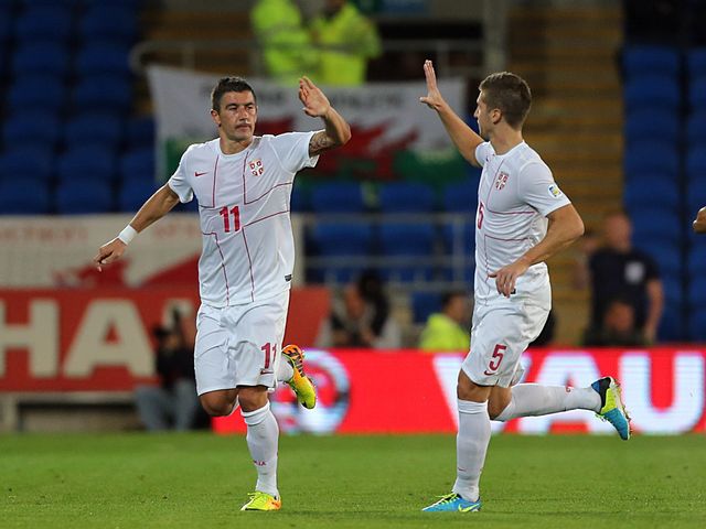 Aleksandar Kolarov celebrates his goal for Serbia