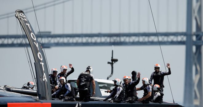 Emirates Team New Zealand wave to the crowd after winning race five