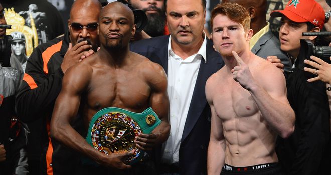 Floyd Mayweather (L) and Saul Alvarez during Friday's weigh-in at the MGM Arena in Las Vegas