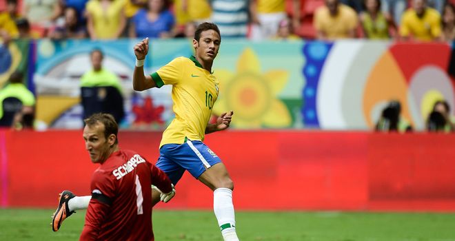 Neymar: Slides the ball past Australia keeper Mark Schwarzer