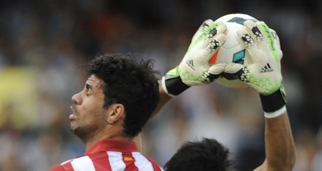 Claudio Bravo collects a cross.