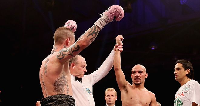 Burns raises his hands with Beltran expecting - like the crowd -the world title to slip away