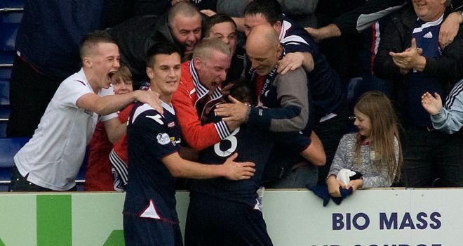 Richard Brittain celebrates his winner with the Ross County fans