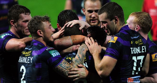Wigan: Celebrate a Blake Green try during the win over Huddersfield