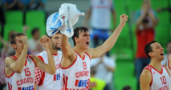 Dario Saric (C) and his Croatia team-mates celebrate victory over Ukraine