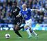 Mikel challenges goalscorer Steven Naismith in the defeat at Everton