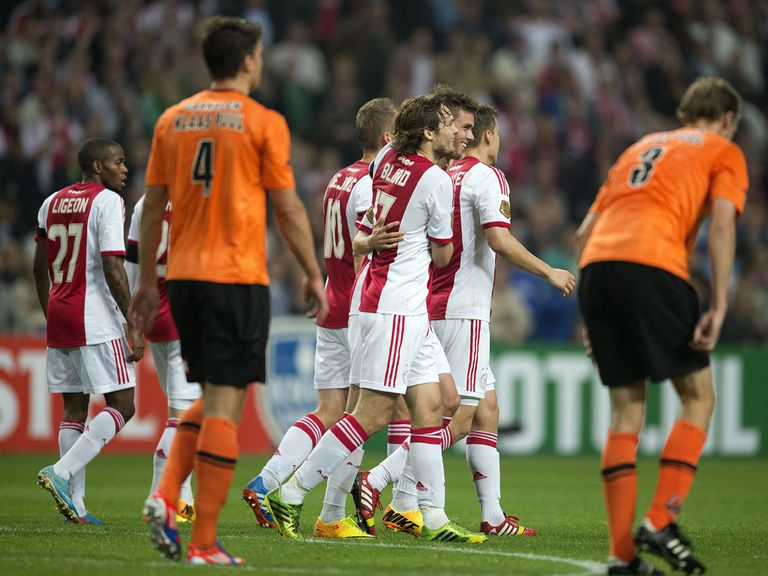 Ajax celebrate as they reach the next round.
