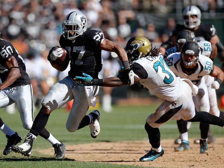 Rashad Jennings makes a storming run forward.