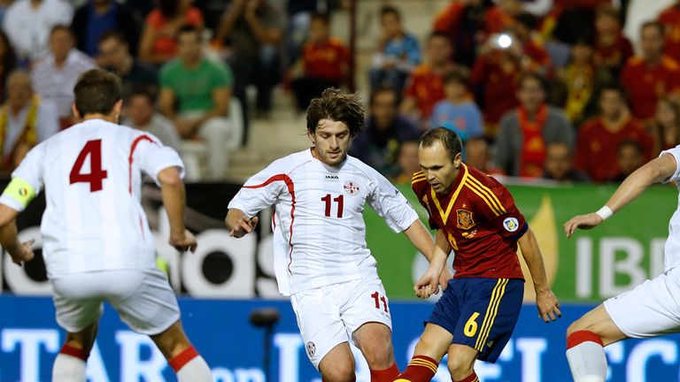Andres Iniesta finds himself surrounded