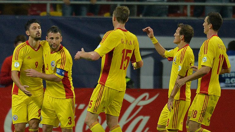 Romania celebrate Ciprian Marica's opening goal