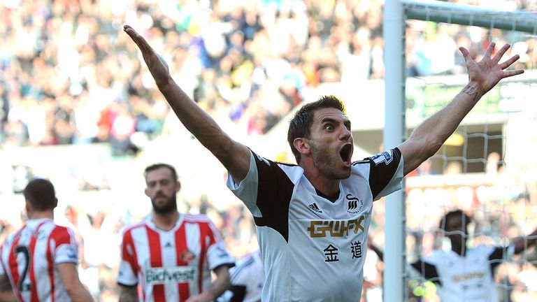 Angel Rangel: The Swansea full-back celebrates after his side's opening goal during the 4-0 win over Sunderland