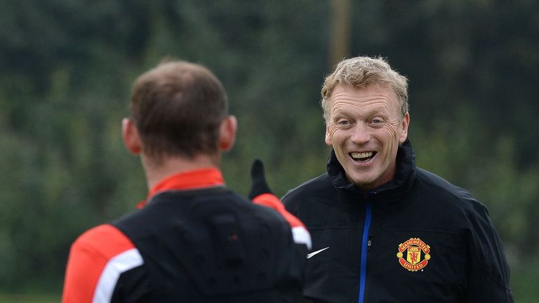 Wayne Rooney shares a joke with David Moyes at Manchester United's training complex