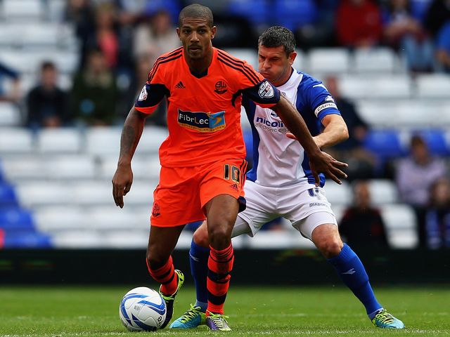 Jermaine Beckford holds off Paul Robinson