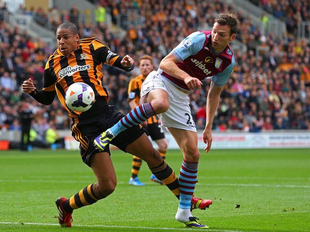 Curtis Davies and Libor Kozak compete for the ball