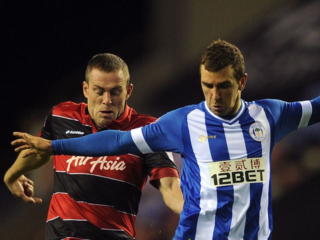 Richard Dunne and James McArthur battle for the ball