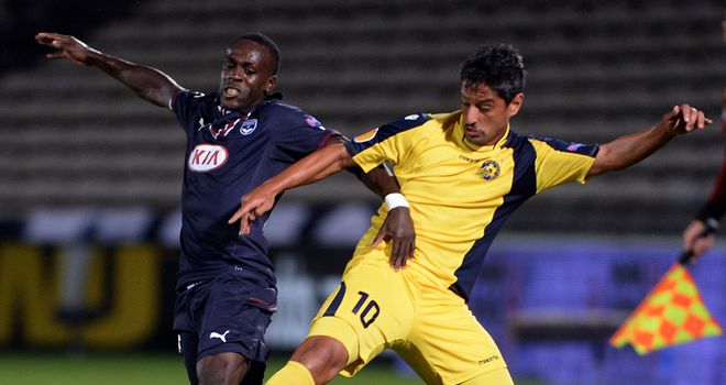 Maxime Poudje and Barak Itzhaki: Battle for ball in Europa League clash