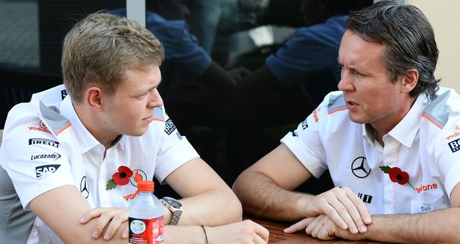 Kevin Magnussen with McLaren's Sporting Director Sam Michael in the Indian GP paddock