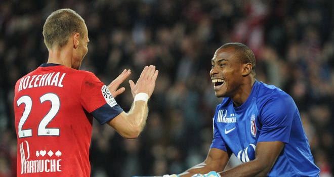 David Rozehnal and Vincent Enyeama celebrate for Lille