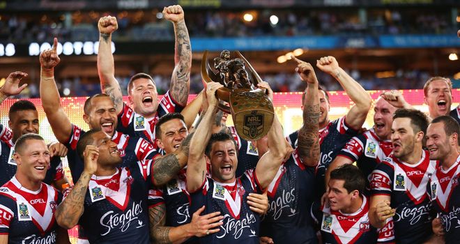 Roosters captain Anthony Minichiello hoists the NRL trophy aloft