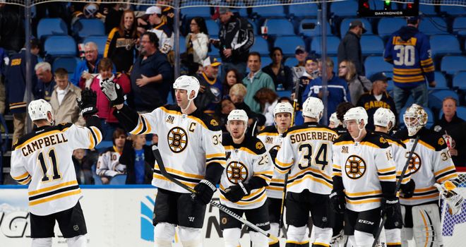 The Boston Bruins celebrate their 5-2 victory over the Buffalo Sabres