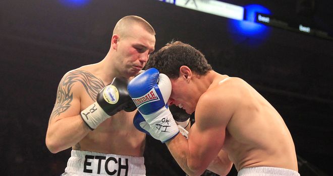 Adam Etches lands a punch during his victory over Alexandre Mendes of Brazil at the Motorpoint Arena in Sheffield (photo courtesy of Lawrence Lustig)