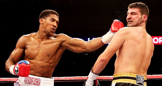 Anthony Joshua (left): Knocked out Emanuele Leo in a round on his pro debut