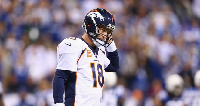 Peyton Manning walks off of the field after losing at the Indianapolis Colts