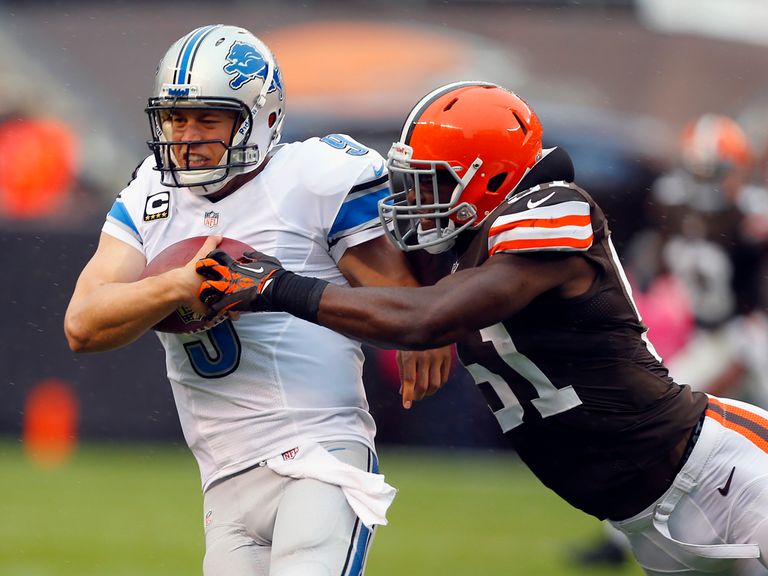 Matthew Stafford is halted by Barkevious Mingo.
