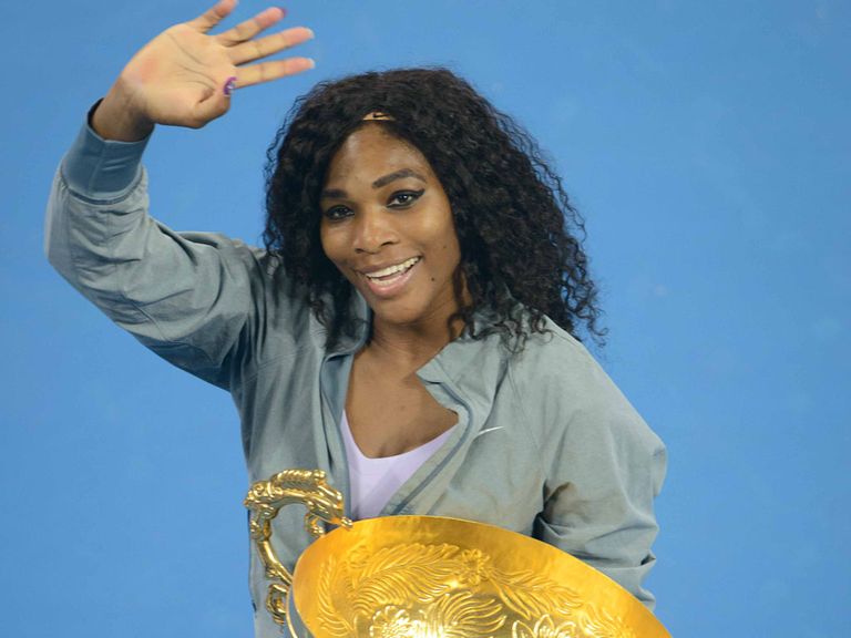 Serena Williams celebrates her China Open win, her 10th WTA title of the season