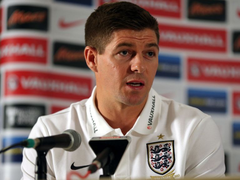 Steven Gerrard faces the press.