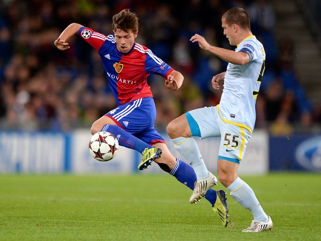 Stocker takes the ball away from Bourceanu.