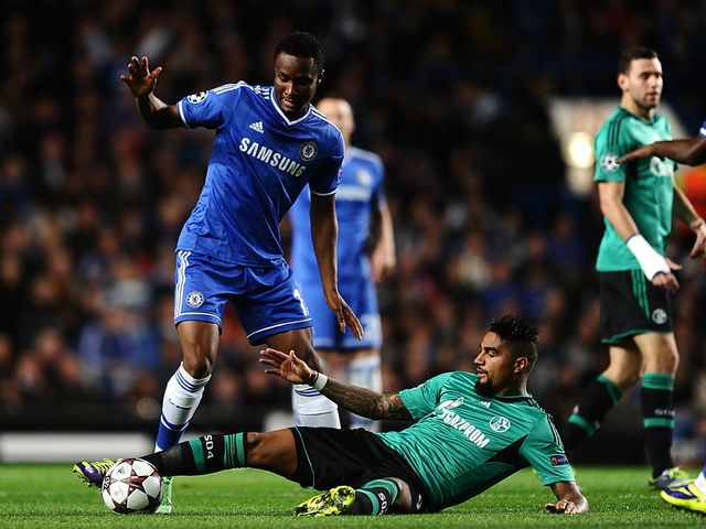 Mikel tries to avoid Boateng.