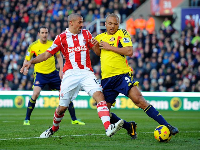 Jonathan Walters is tackled by Wes Brown