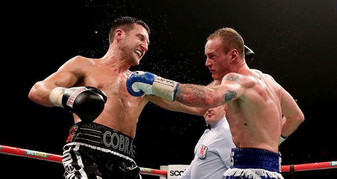 Carl Froch retained titles after a brutal battle with George Groves