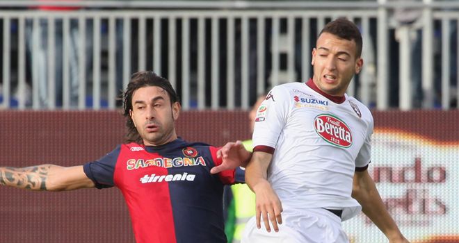 Daniele Conti battles for the ball against Torino