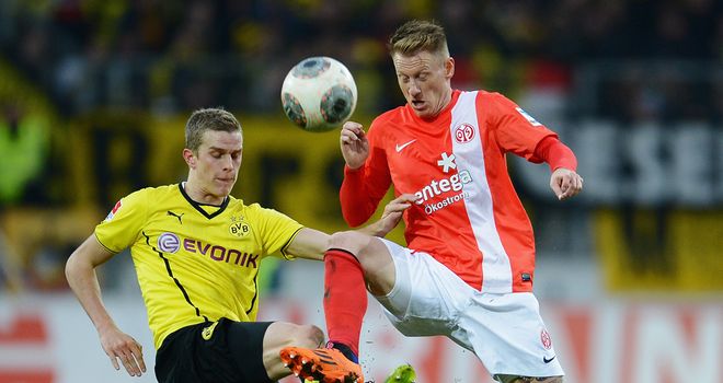 Sven Bender and Niki Zimling tussle for the ball