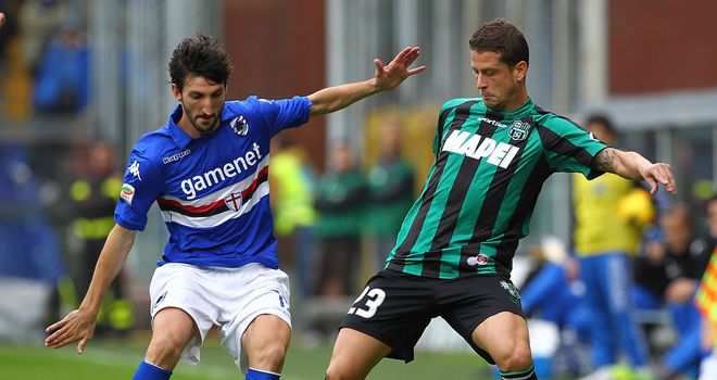 Davide Gavazzi and Marcello Gazzola battle for the ball