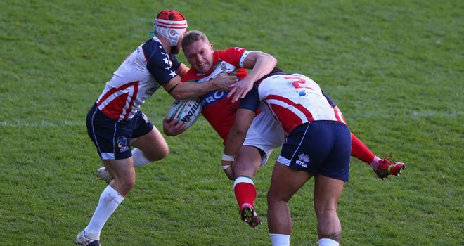 Christiaan Roets is upended by Craig Priestly (L) and Bureta Faraimo (R)