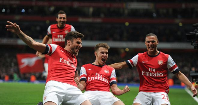 Arsenal celebrate as Aaron Ramsey's goal clinched a 2-0 win over Liverpool