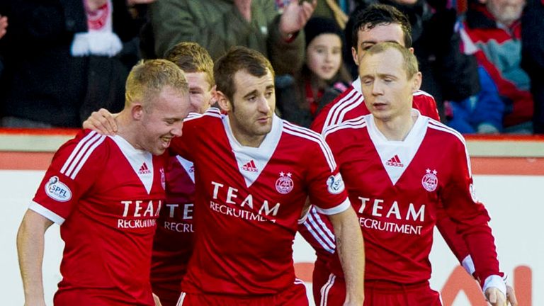 Nicky Low (L): Mobbed by his teammates after a stunning free-kick