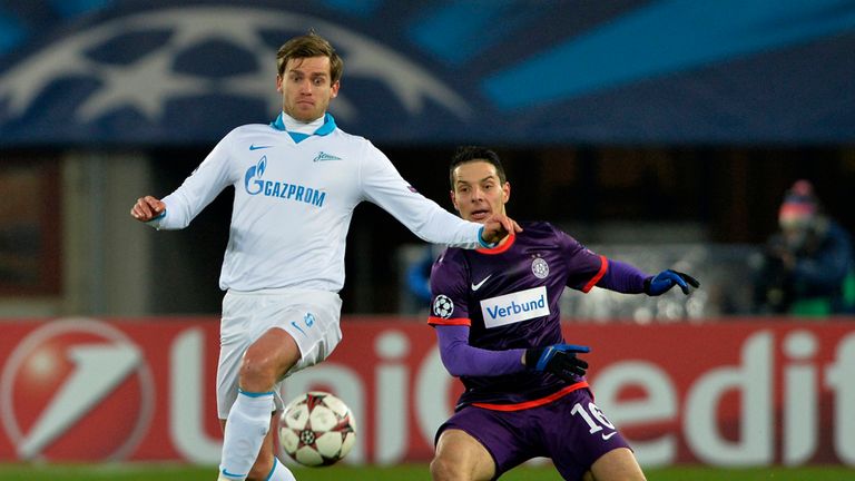 Nicolas Lombaerts: Knocks the ball away from Philipp Hosiner