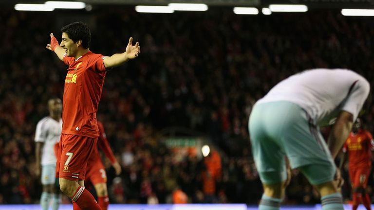 Luis Suarez: Celebrates after his shot deflected in off Joey O'Brien