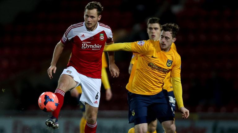Joe Clarke: Wrexham goalscorer battles with Oxford's Scott Davies