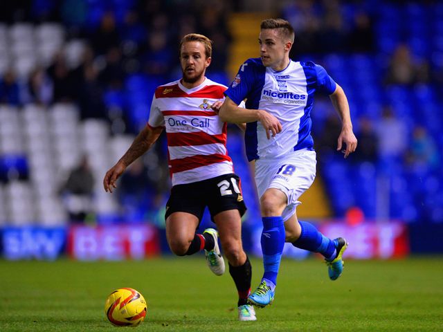 James Coppinger and Mitch Hancox battle for the ball