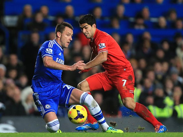 John Terry tries to stop Luis Suarez