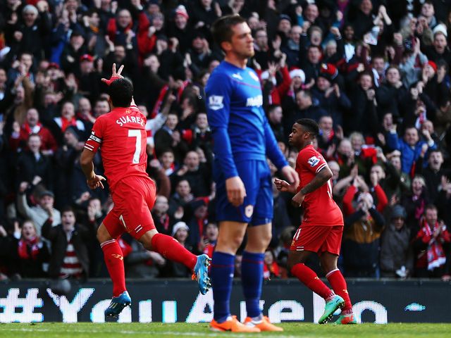 Luis Suarez celebrates scoring for Liverpool