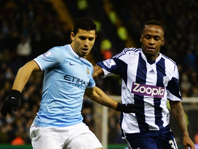 Sergio Aguero and Saido Berahino battle for the ball